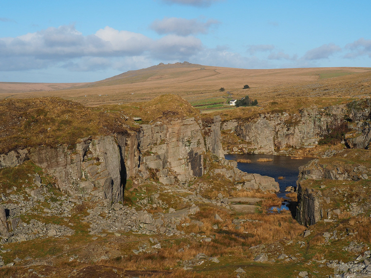 Foggintor Quarry with Yellowmead Farm and Great Mis Tor beyond